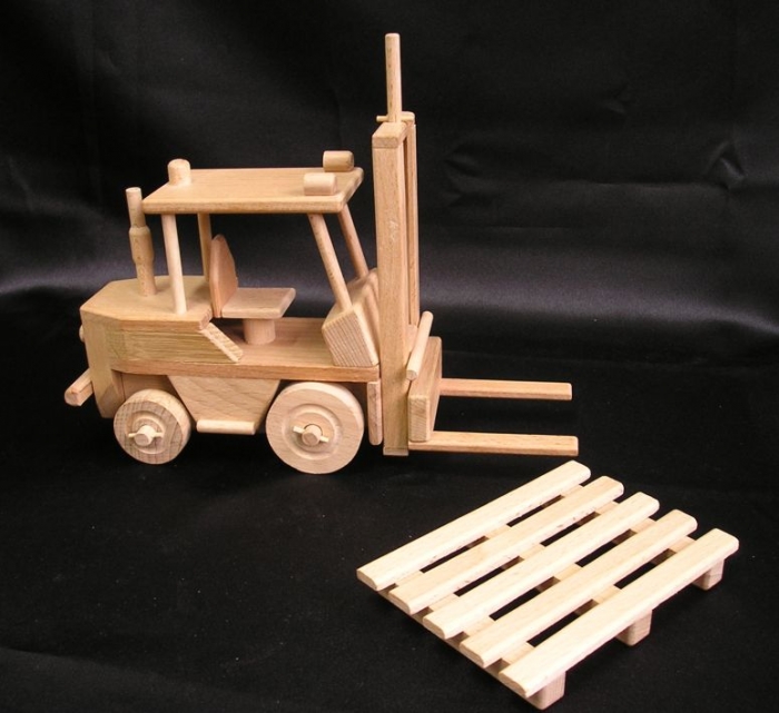 Forklift with wooden pallet.